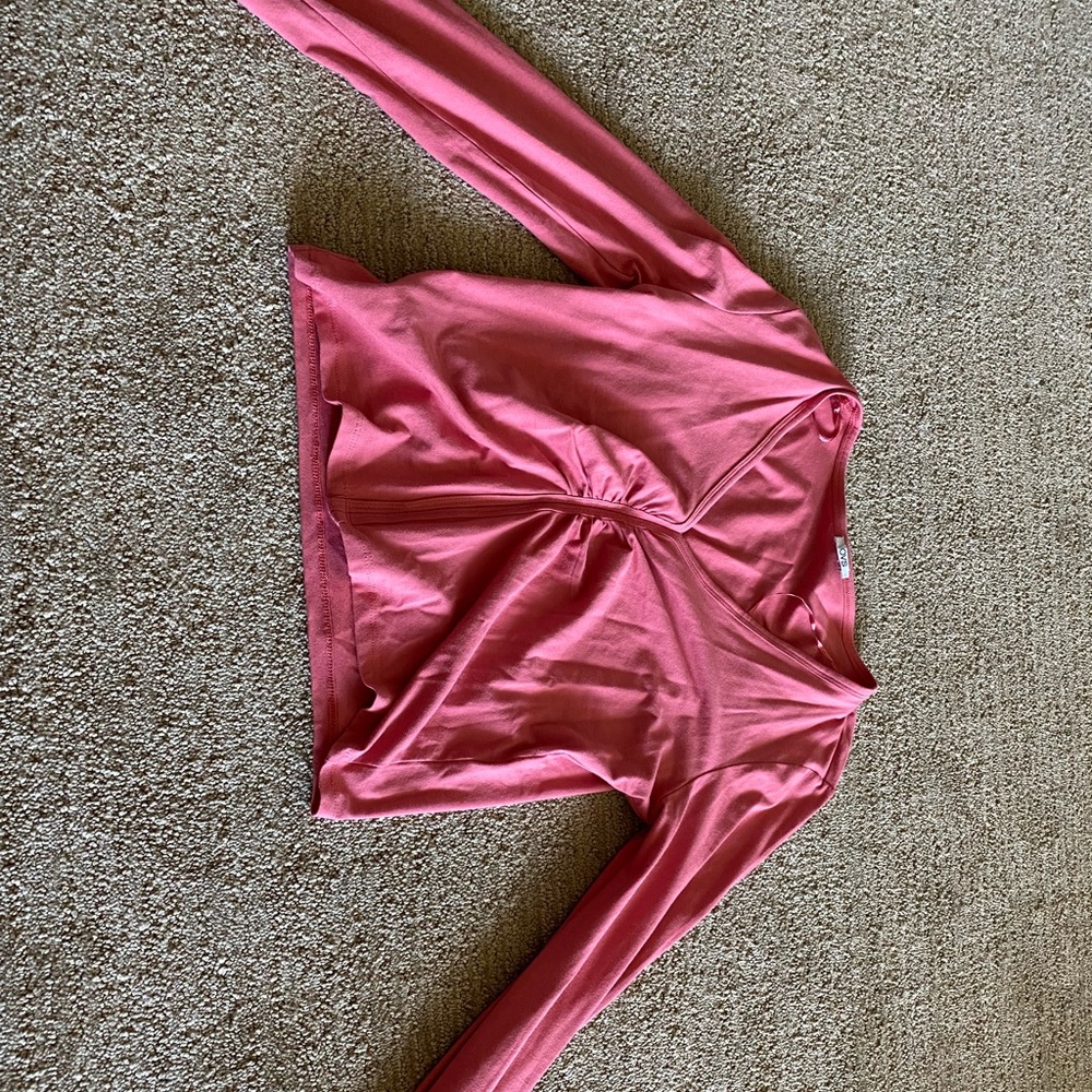 Ruffled pink long sleeved crop top